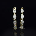 https://cdn.shopify.com/s/files/1/0571/2825/5601/files/moissaniteearrings.jpg?v=1745059078
